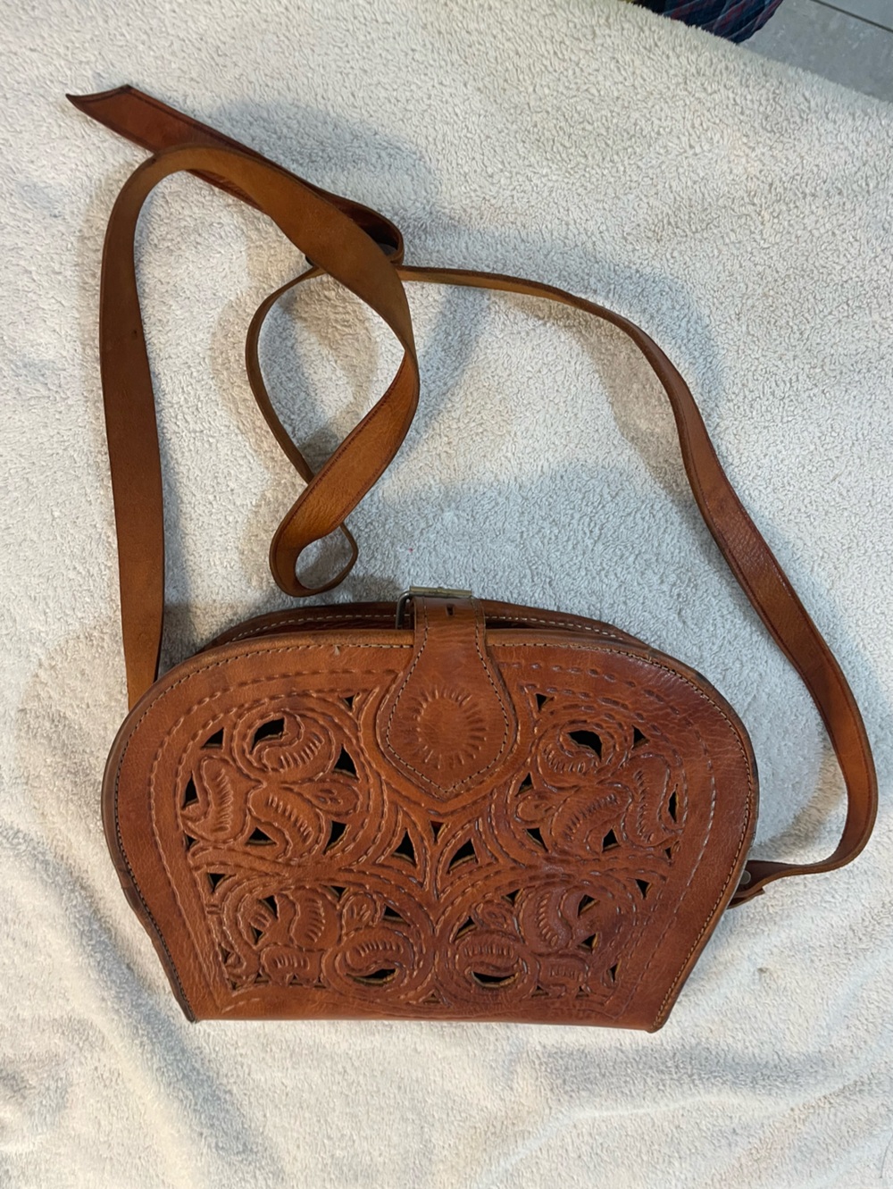 Tooled leather crossbody bag